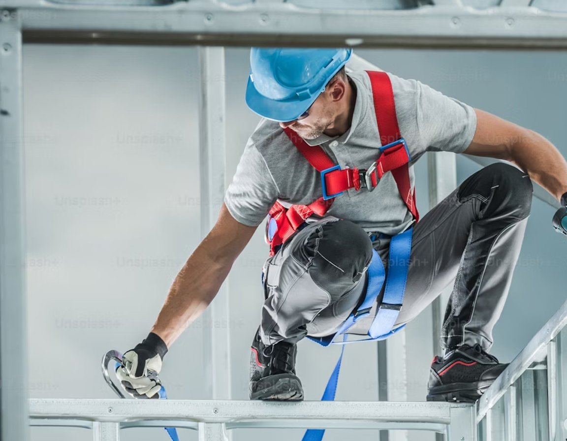 Construction worker wearing a safety harness